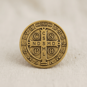 Bronze Saint Benedict medal with Latin inscriptions and cross symbols